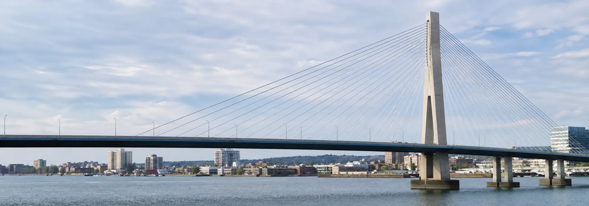 Bridge and city infrastructure representing a connected U.S. expansion
